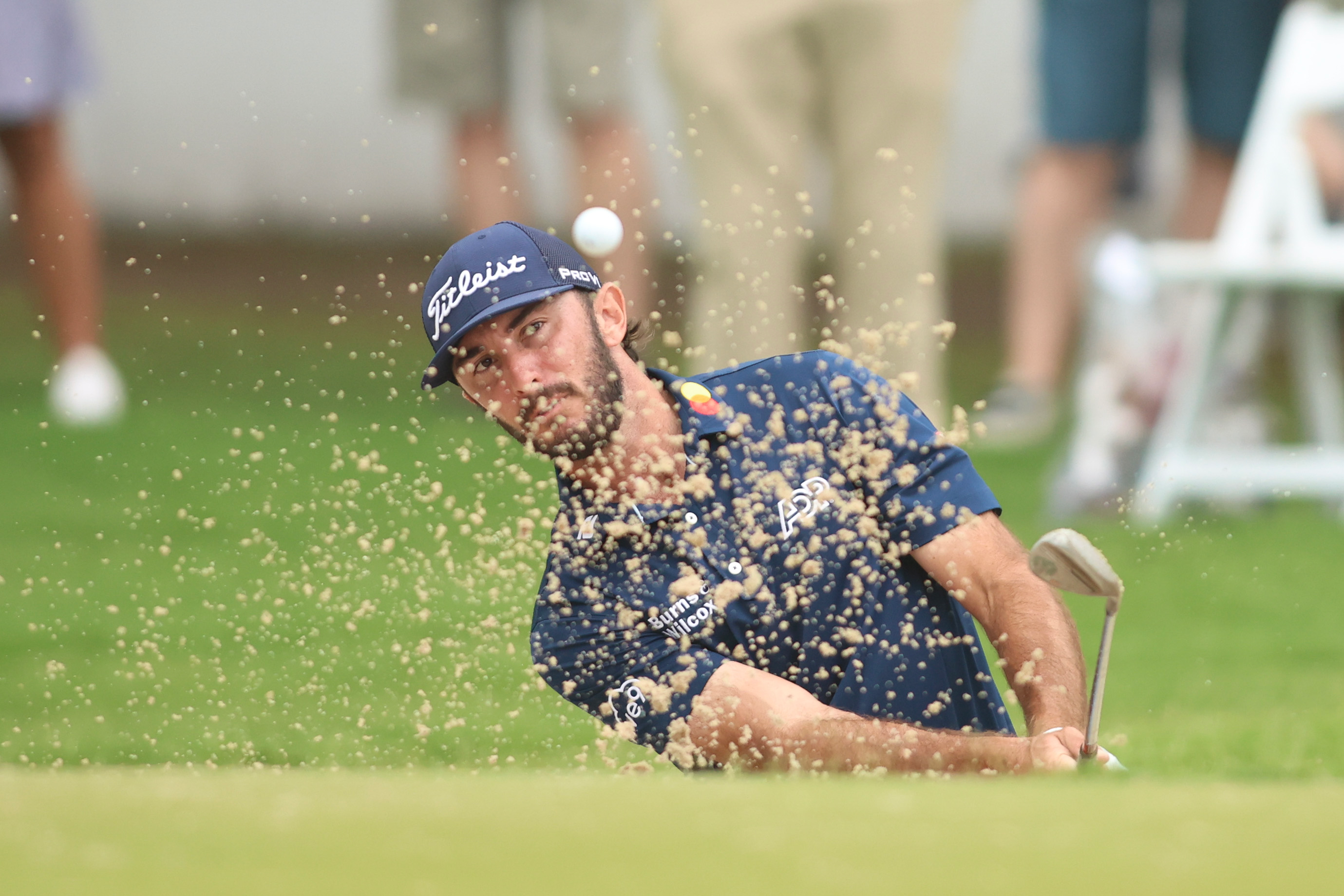 Golfer shooting from Sand