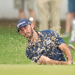 Golfer shooting from Sand