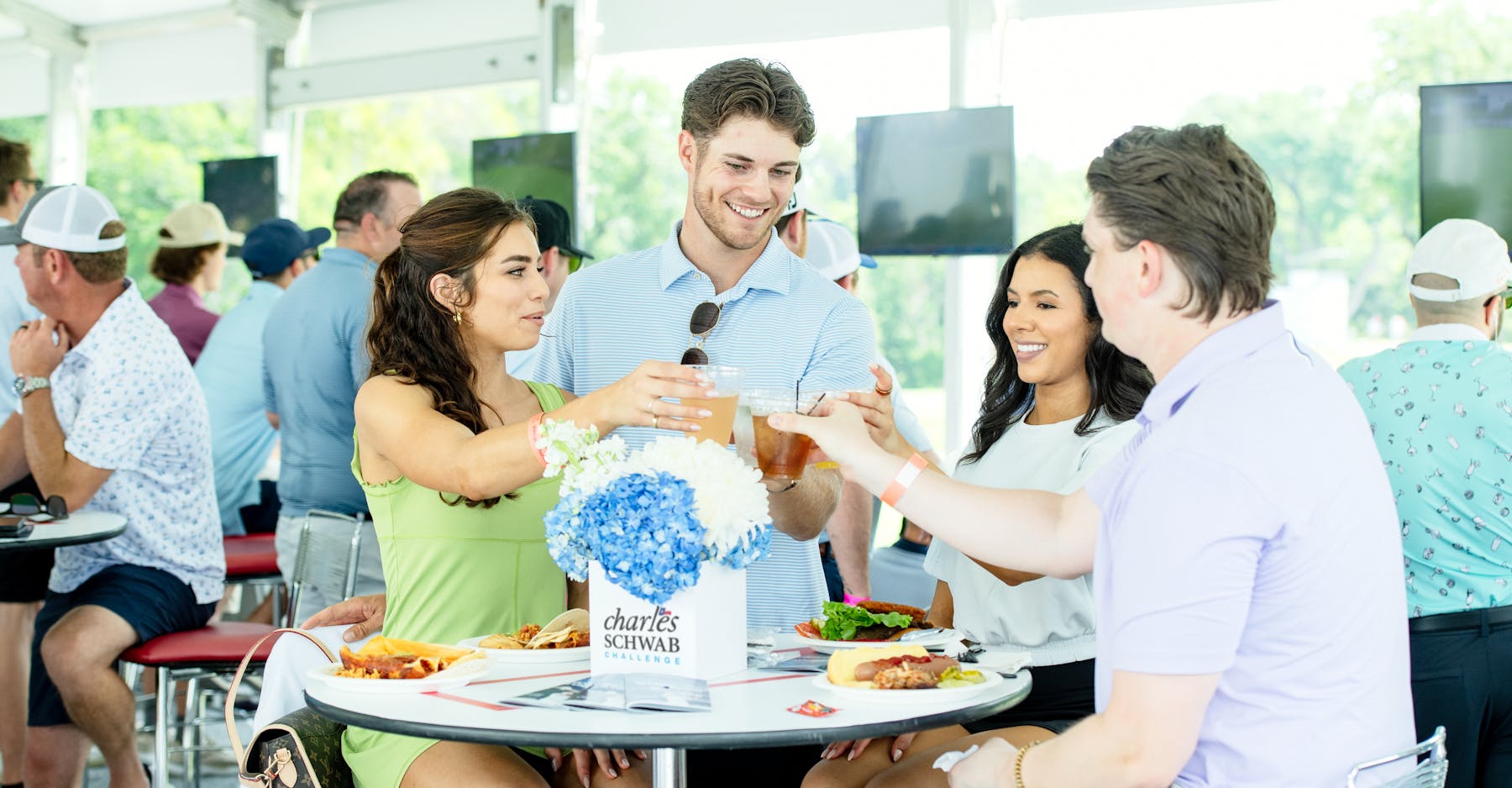 Models Cheering at Table