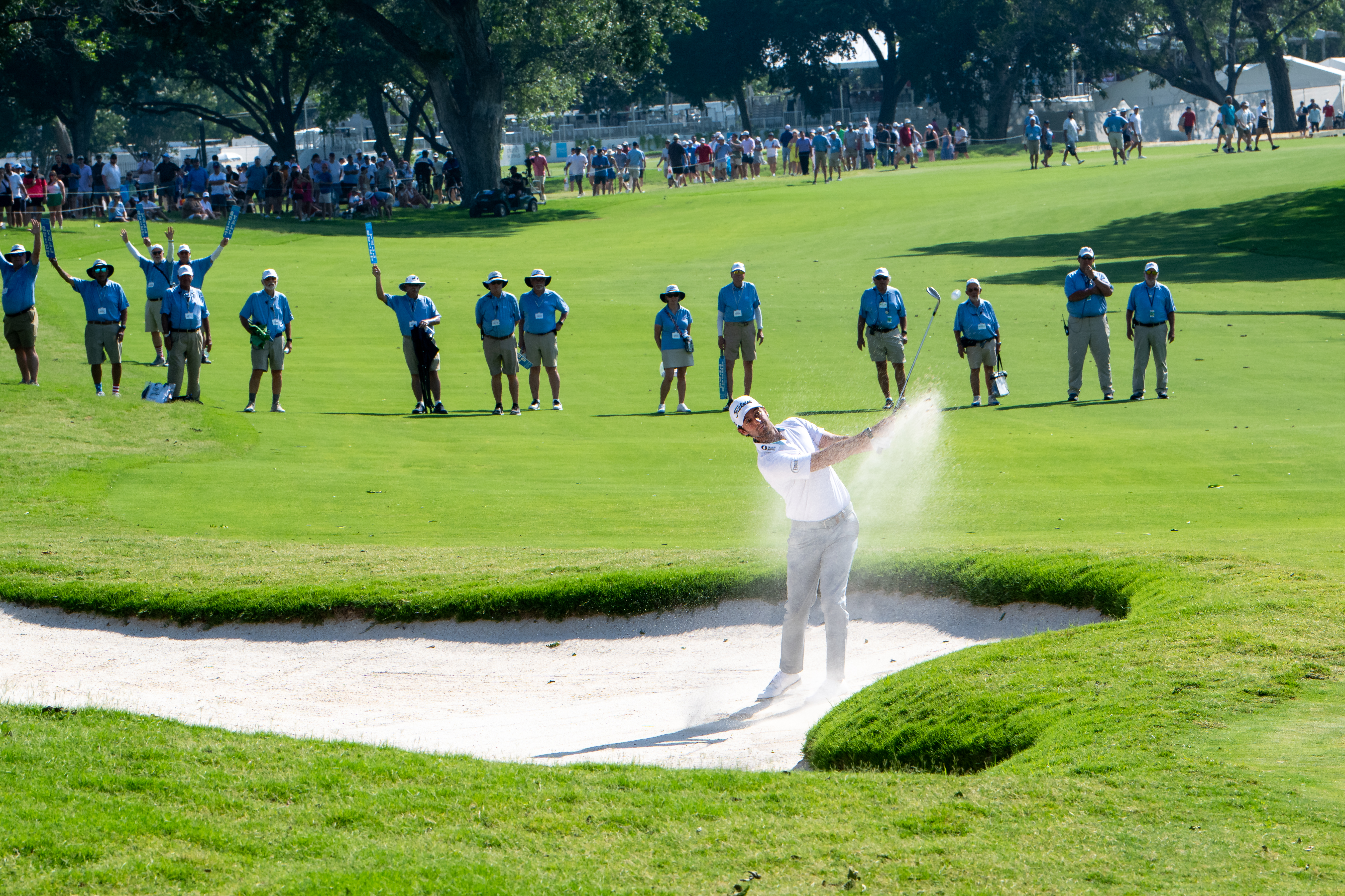 Volunteers behind golfer