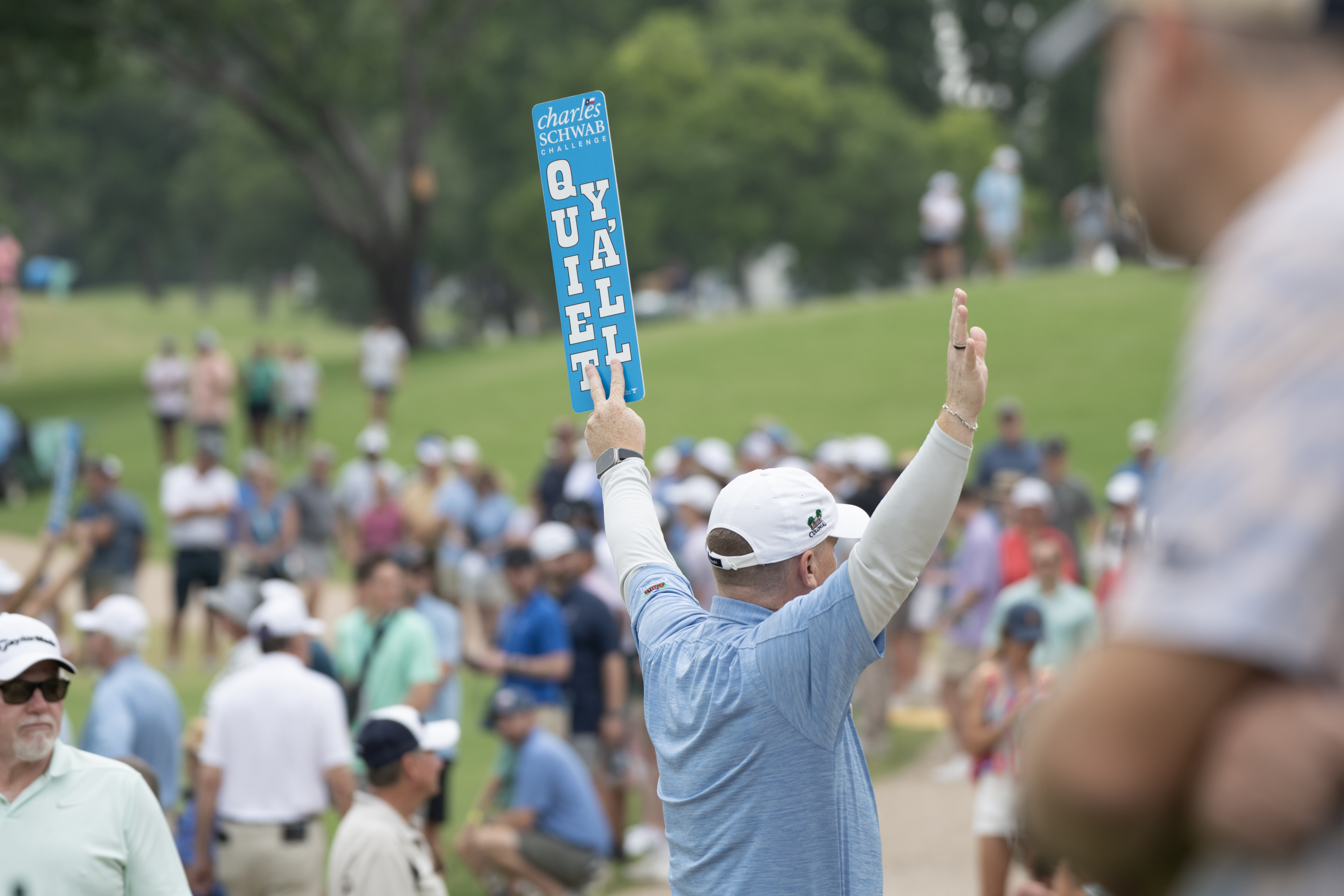 Man keeping crowd quiet