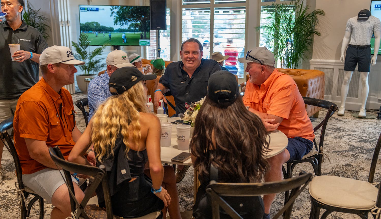 Fans visiting at table