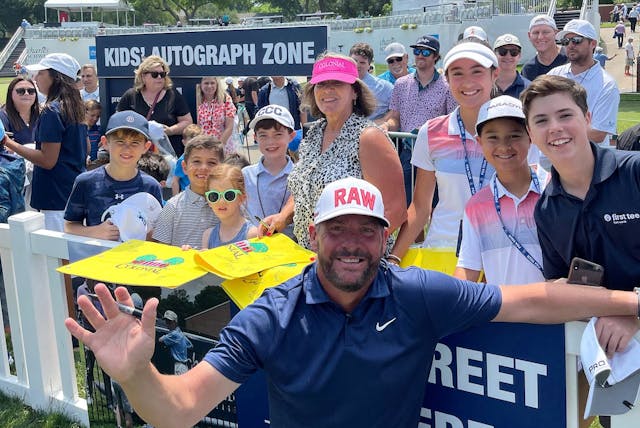 Pro giving autograph