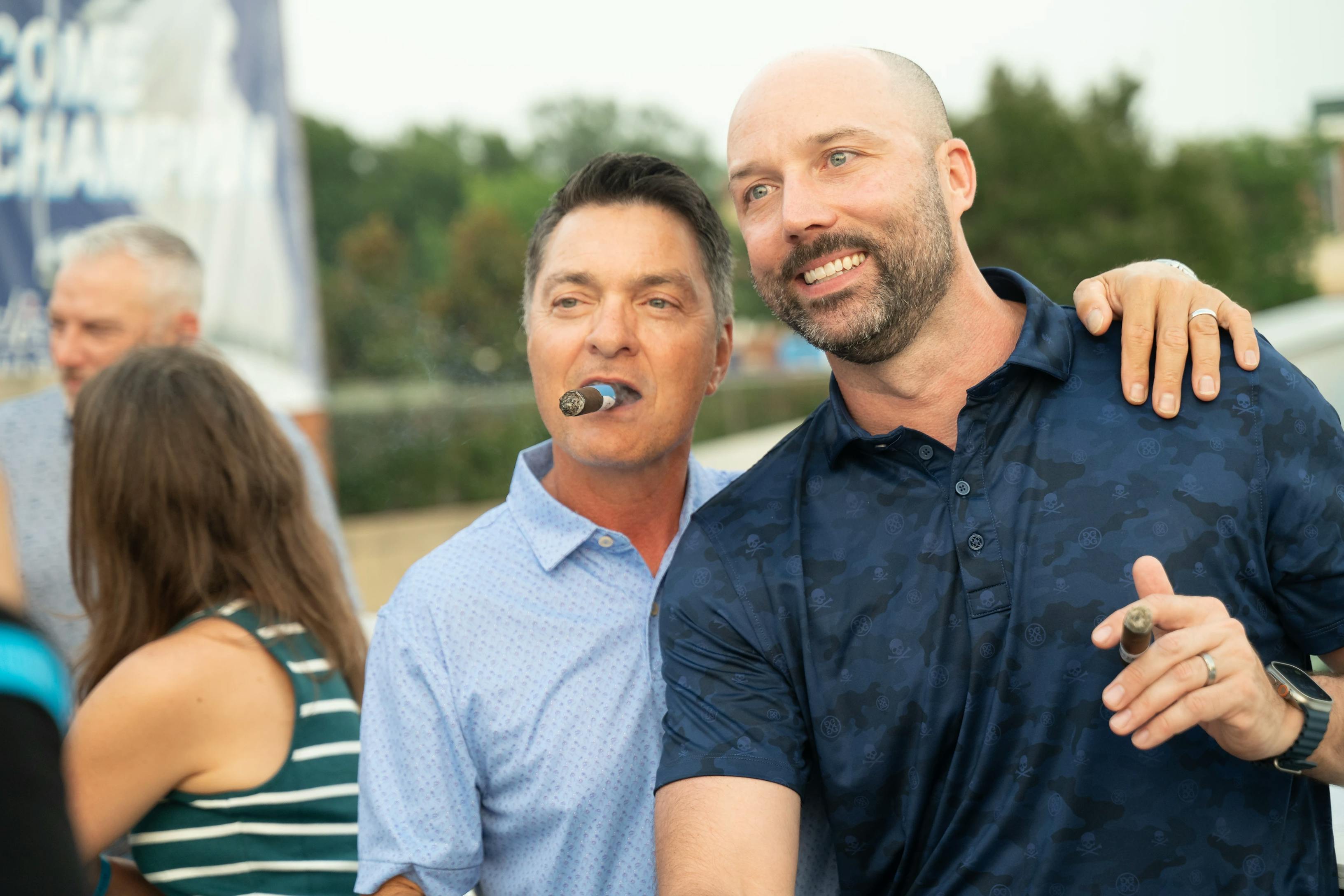 two guys with cigars