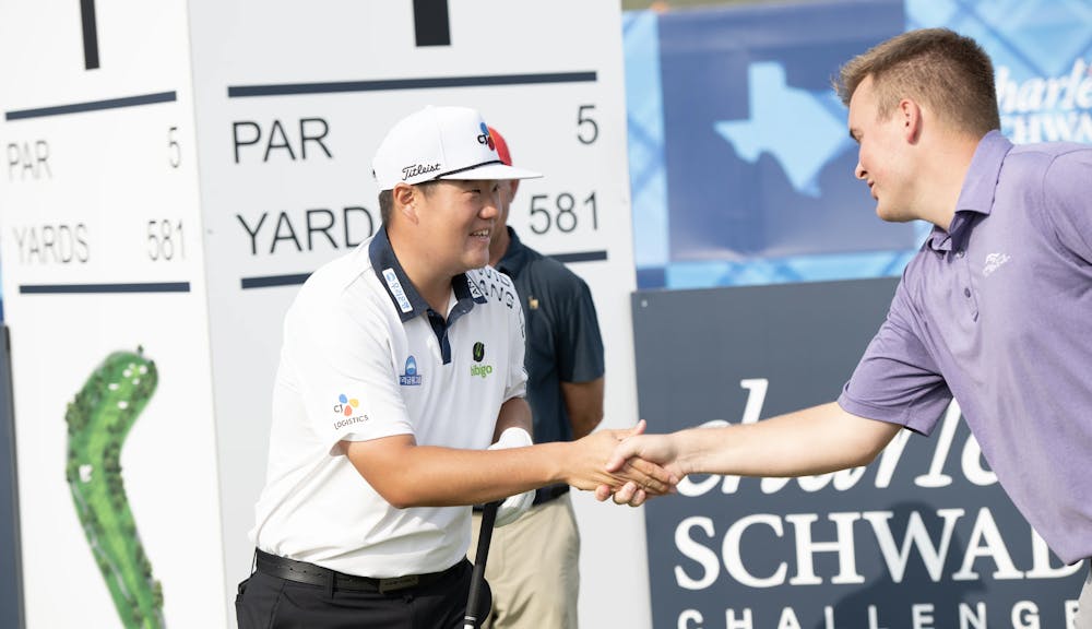 pro-golfer meeting player at pro-am