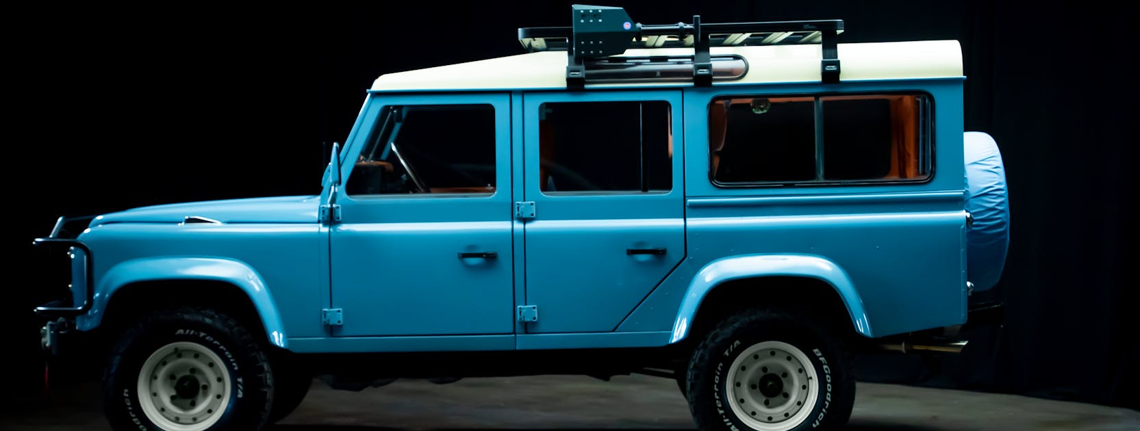 2025 Prize Car Defender Side View