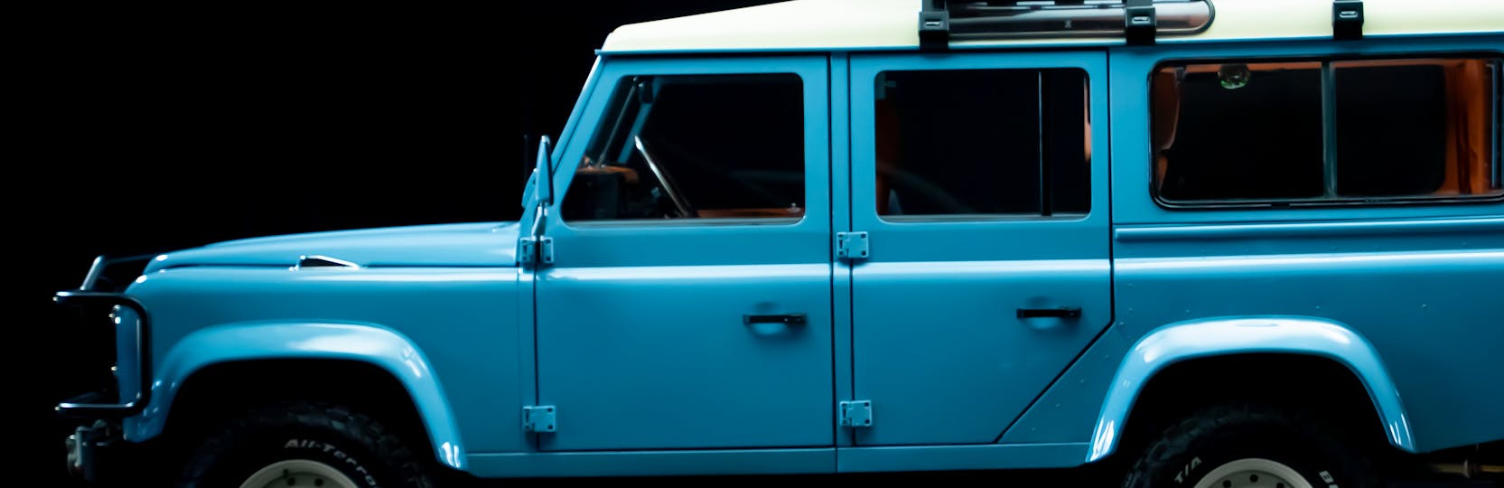 2025 Prize Car Defender Side View