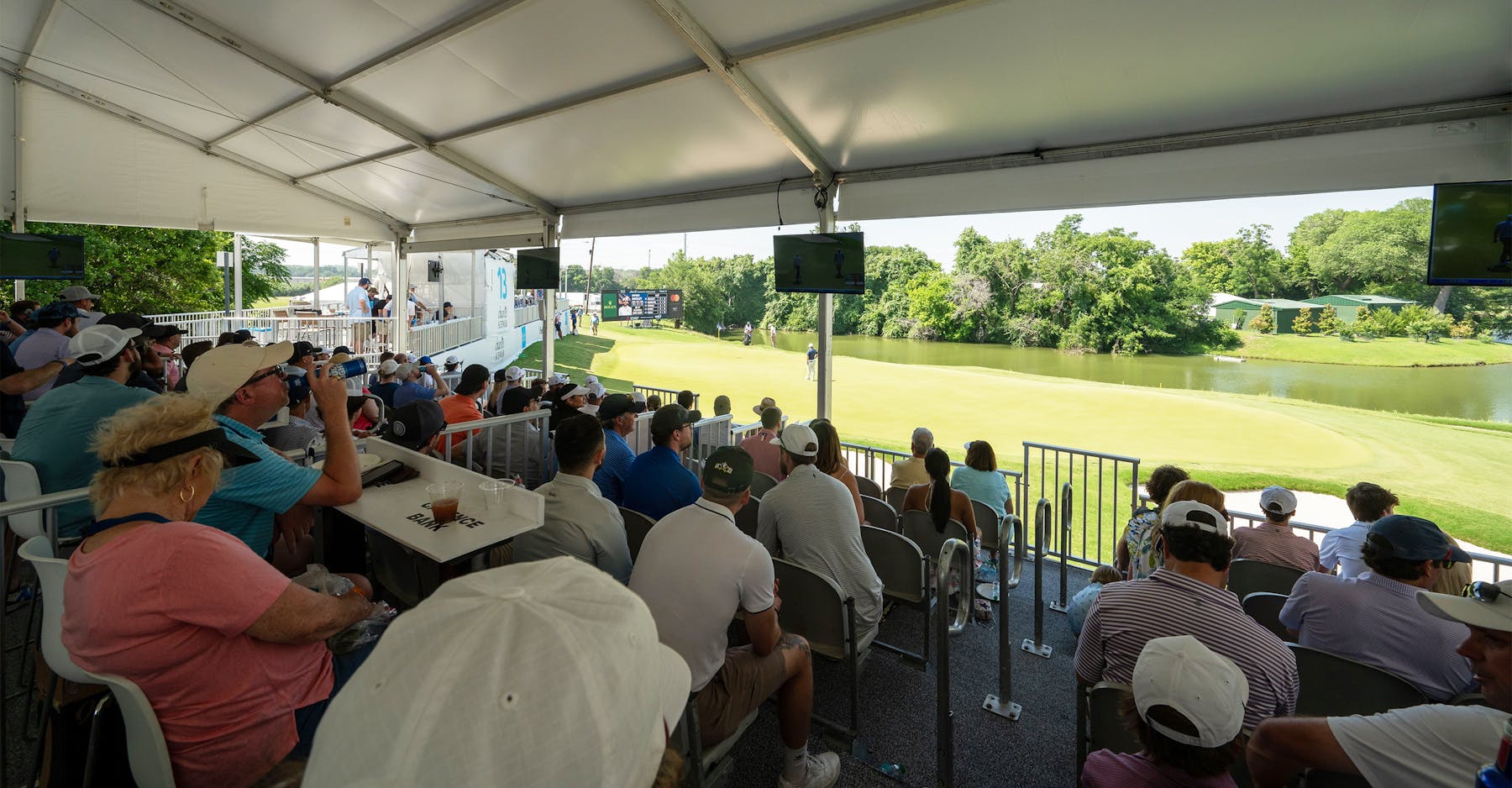 Fans in private suite at 13th hole