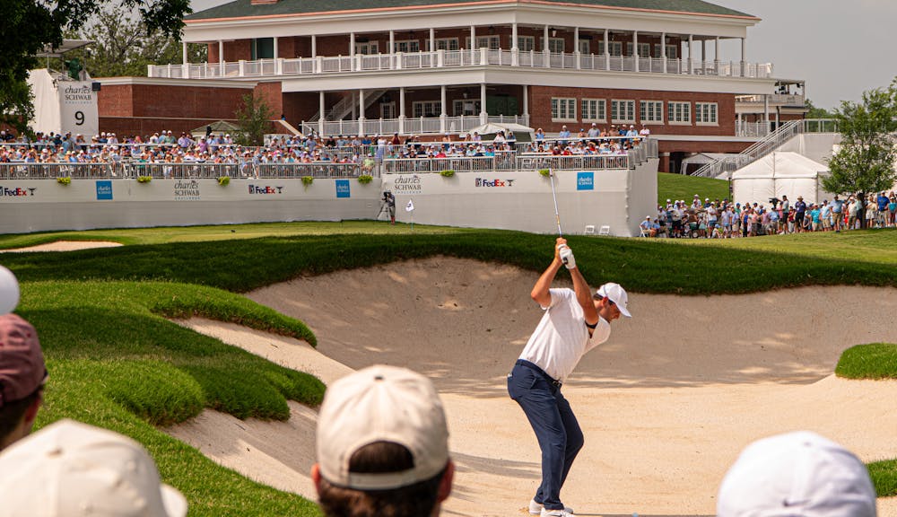 Golfer swinging club