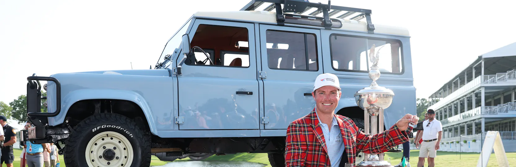 Ben Griffin on stage with trophy