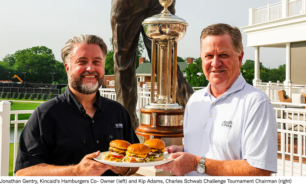 Jonathan Gentry and Kip Adams holding hamburgers