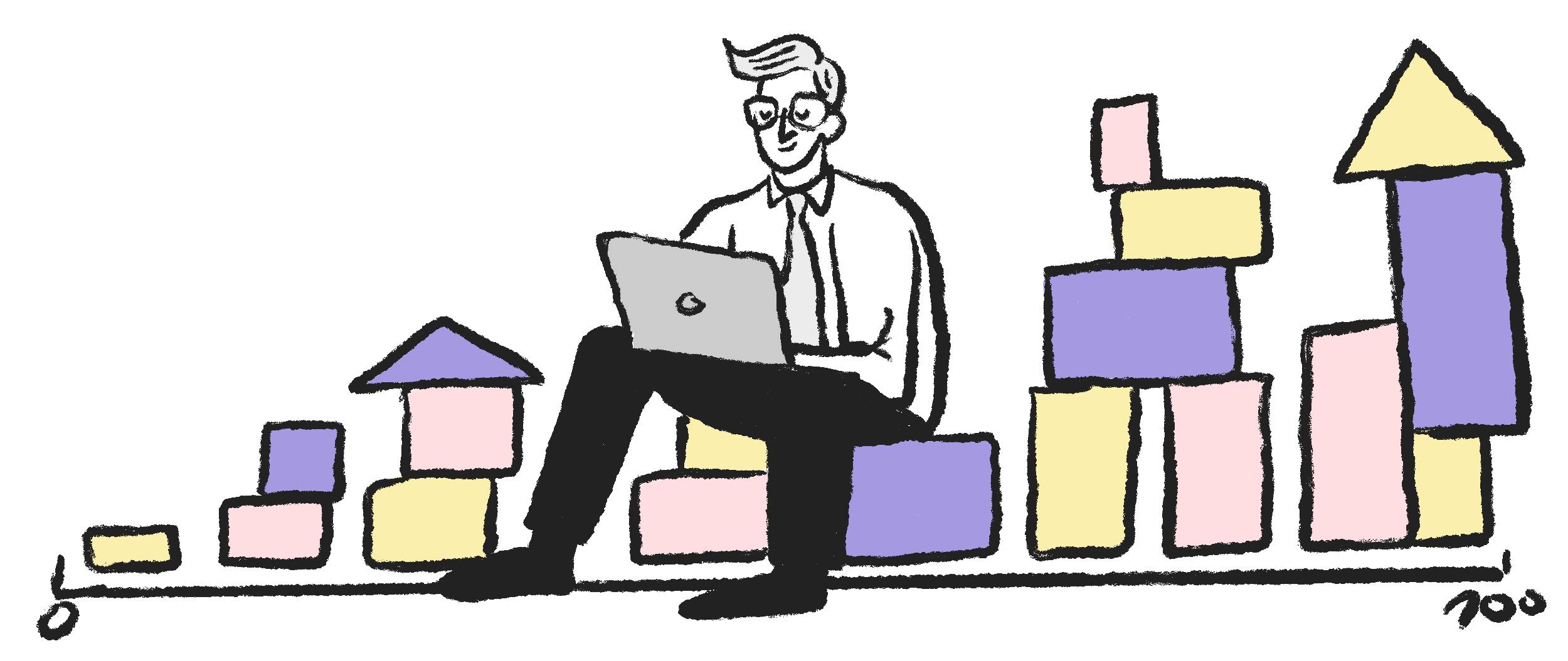 Un hombre sentado en bloques usando una computadora