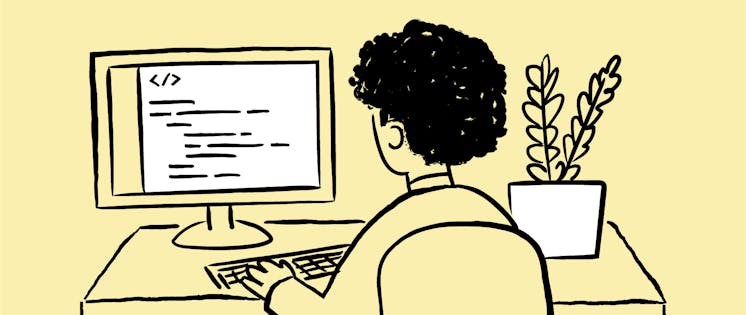 Una persona de espaldas consultando su ordenador.