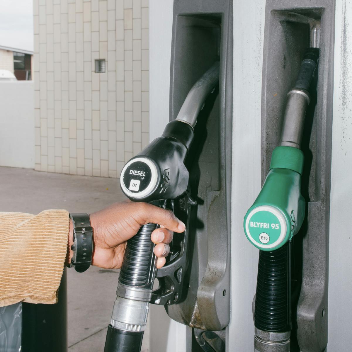 An employee about to fuel his car and receive the fuel expenses