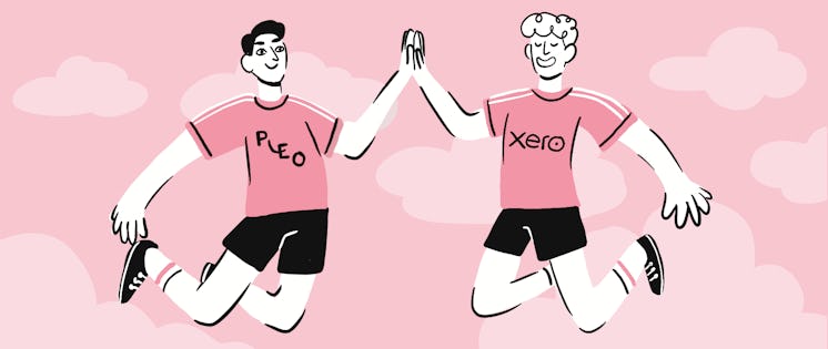 Two smiling people jump in the air and high-five each other. One is wearing a Pleo t-shirt and the other a Xero t-shirt