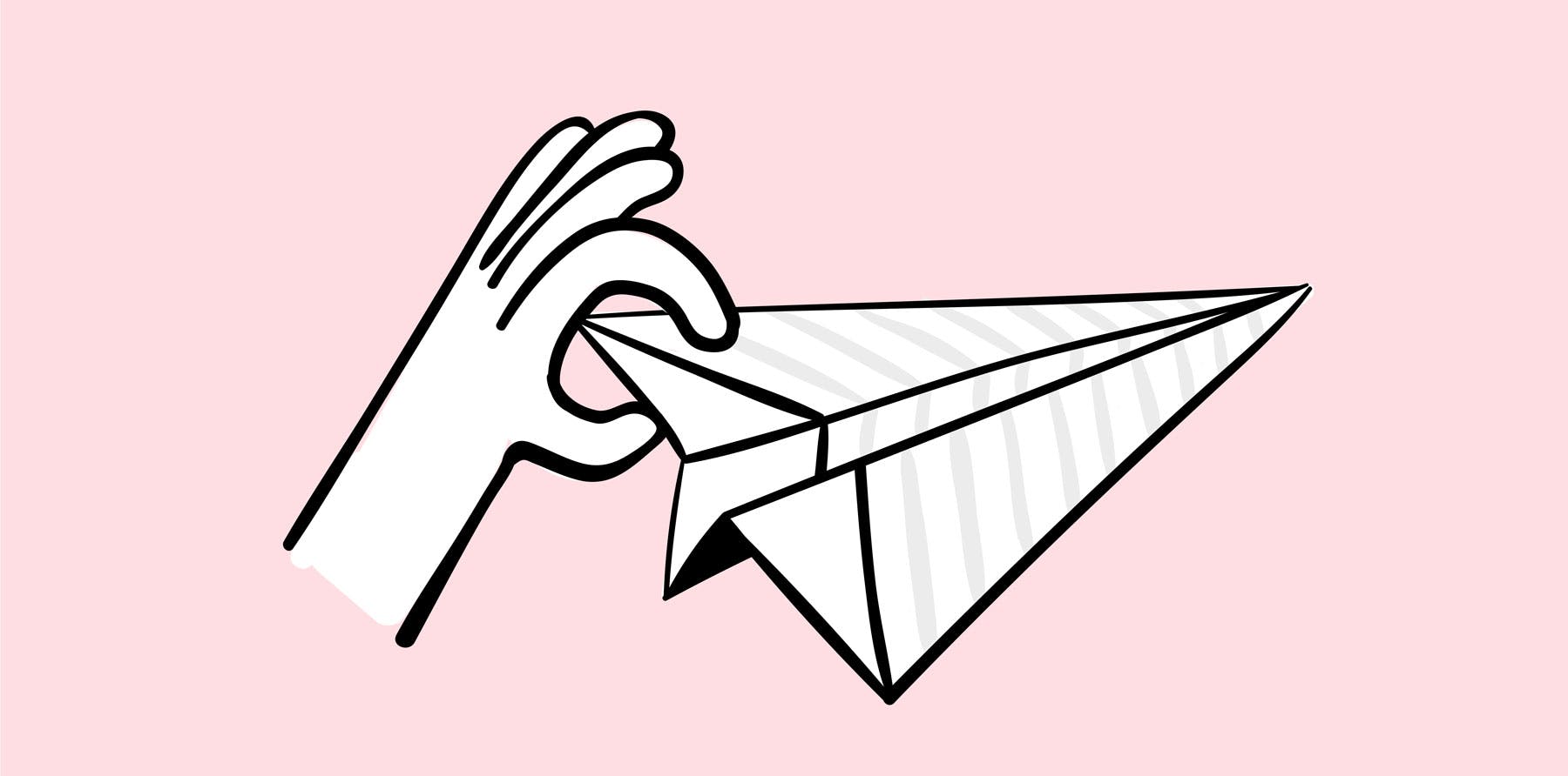Una mano a punto de lanzar un avión de papel.