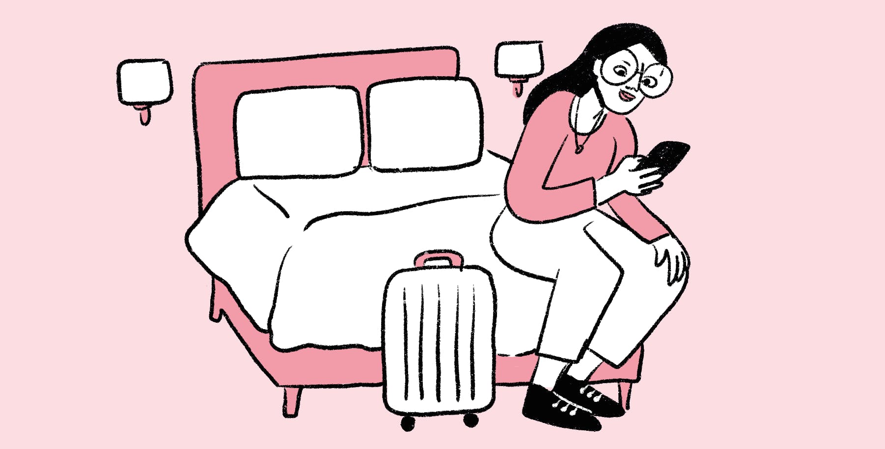 Woman sitting in a bed with suitcase and mobile