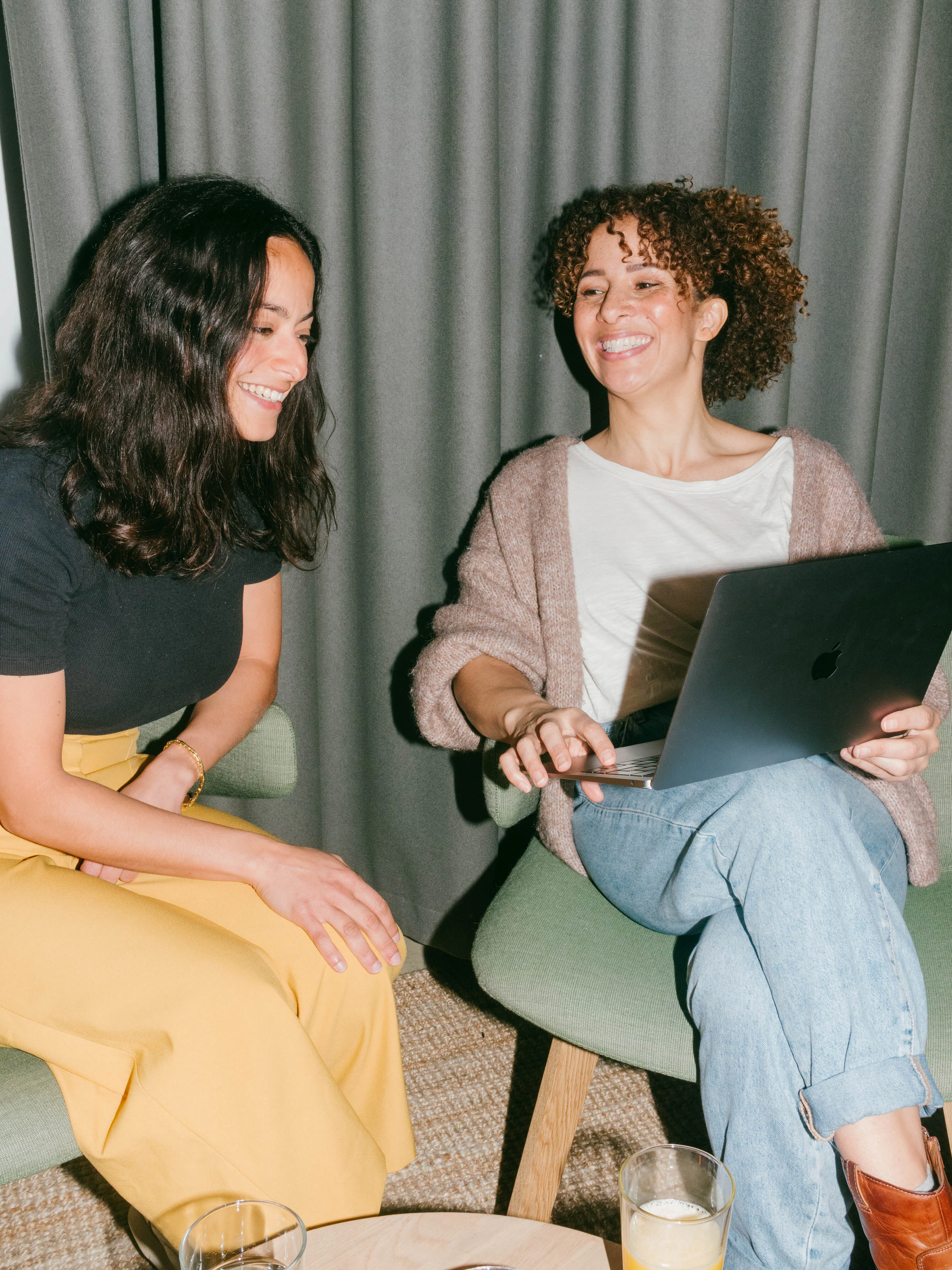 two users enjoying using Pleo on their laptop