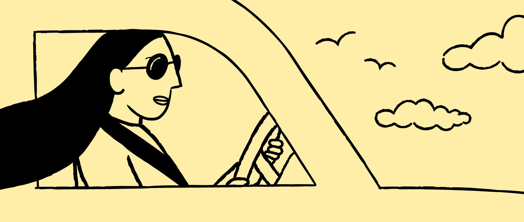 Kvinde der kører en bil