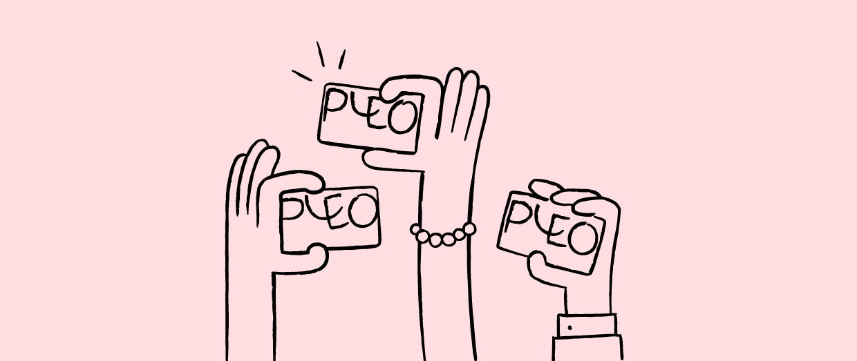 Three hands holding Pleo company cards