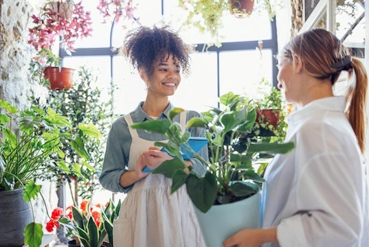 A florist talks to her client