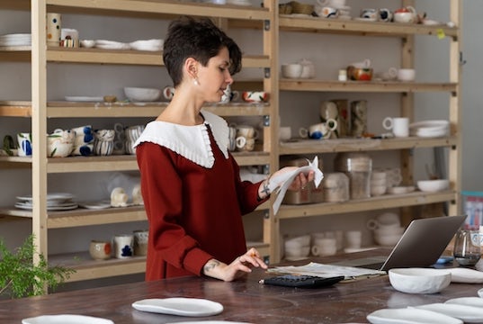 Shop owner reviews her expenses to find potential savings