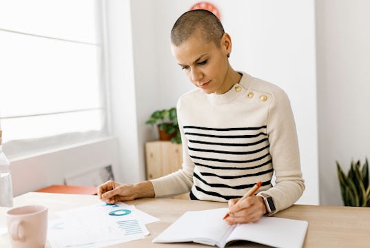 Young professional reviews cash flow statements