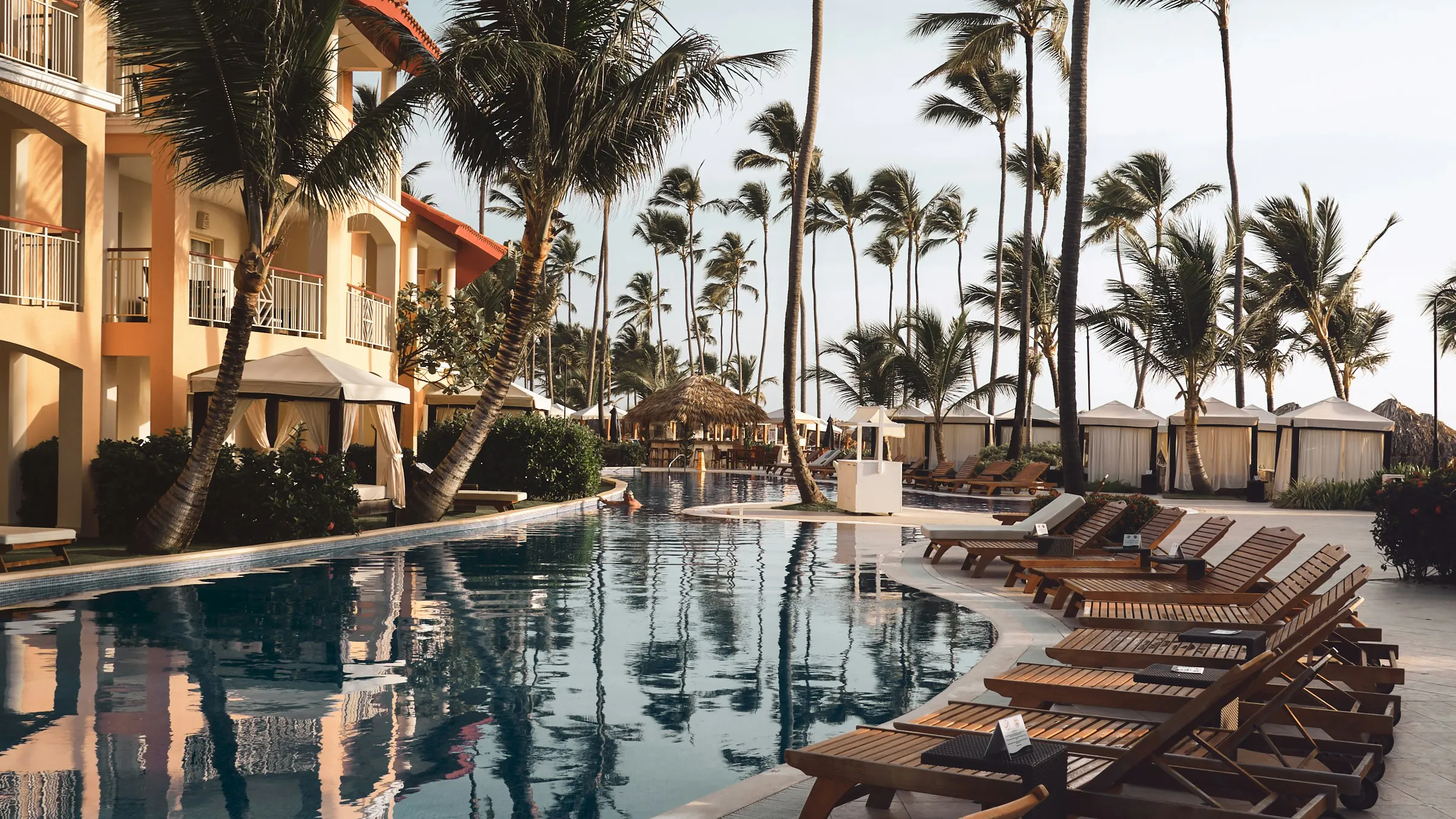 Chairs in front of pool at a fancy resort