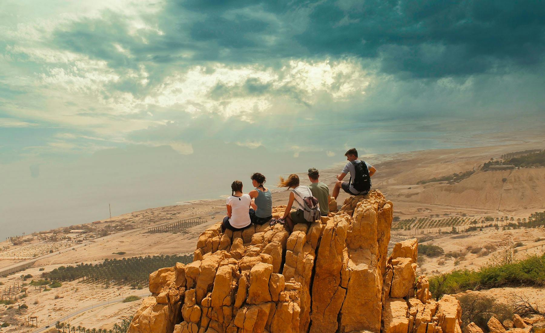 Young people looking at the Dead Sea