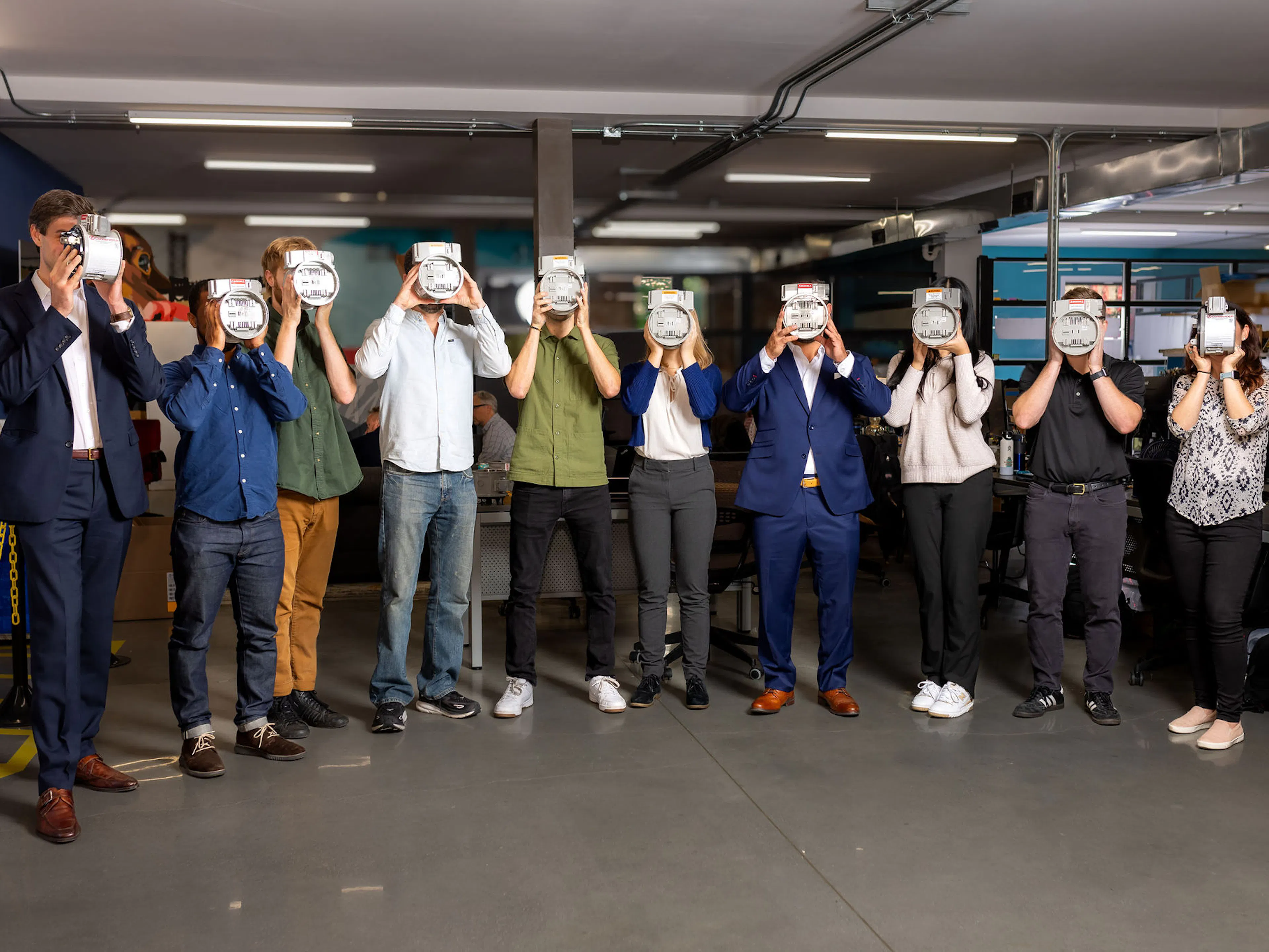 The ConnectDER team standing in their office in Philadelphia, PA.