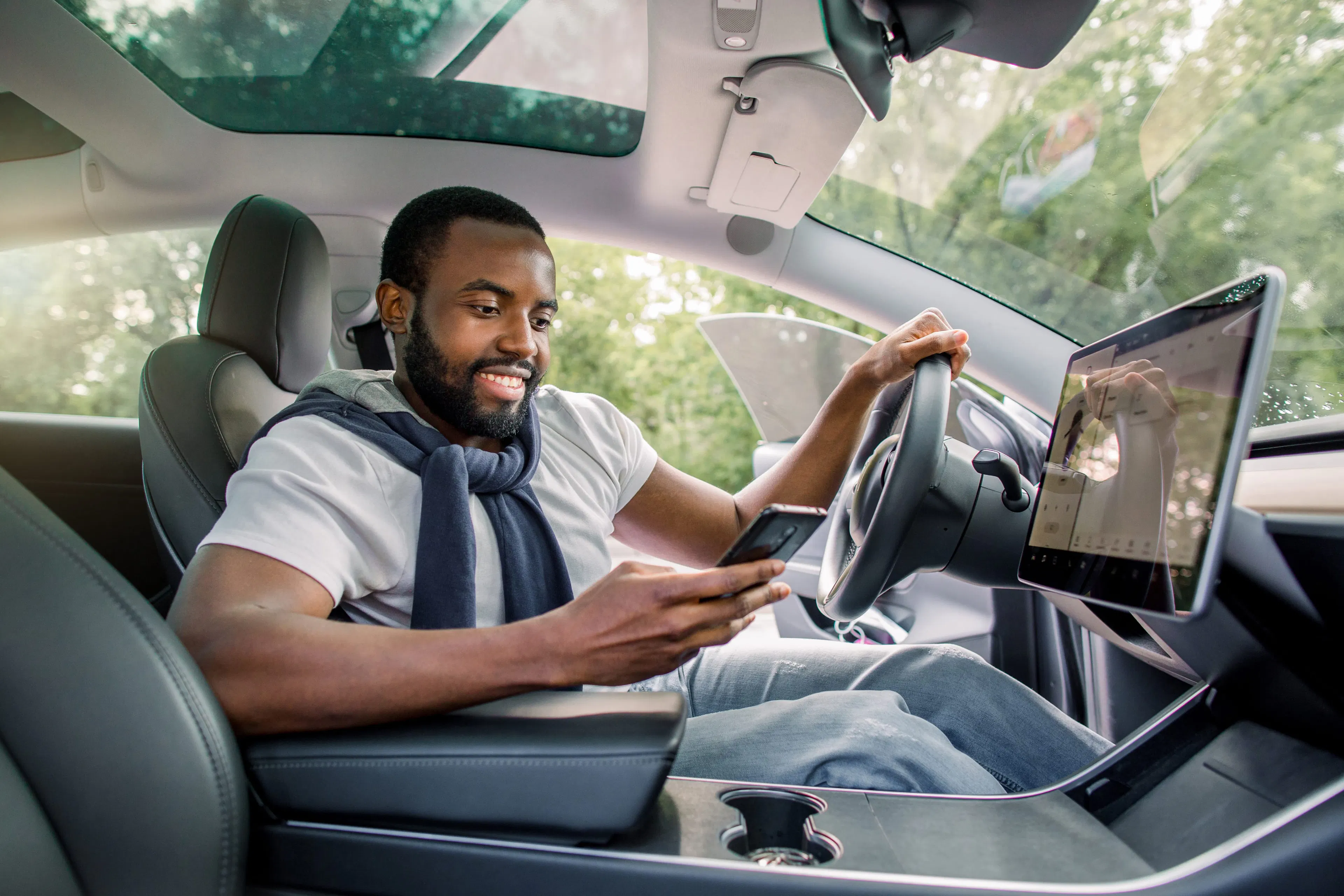 A man inside his electric vehicle.