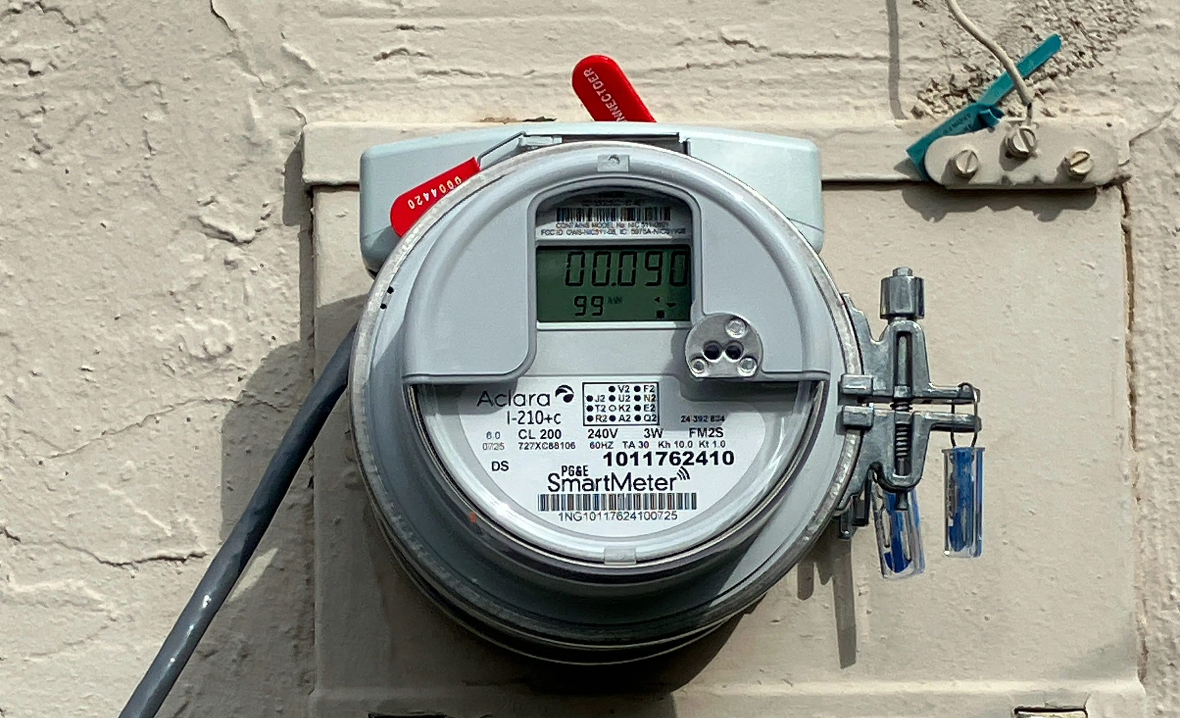 A ConnectDER meter socket adapter installed on a meter-main combination panel, behind the utility billing meter, in a socket.
