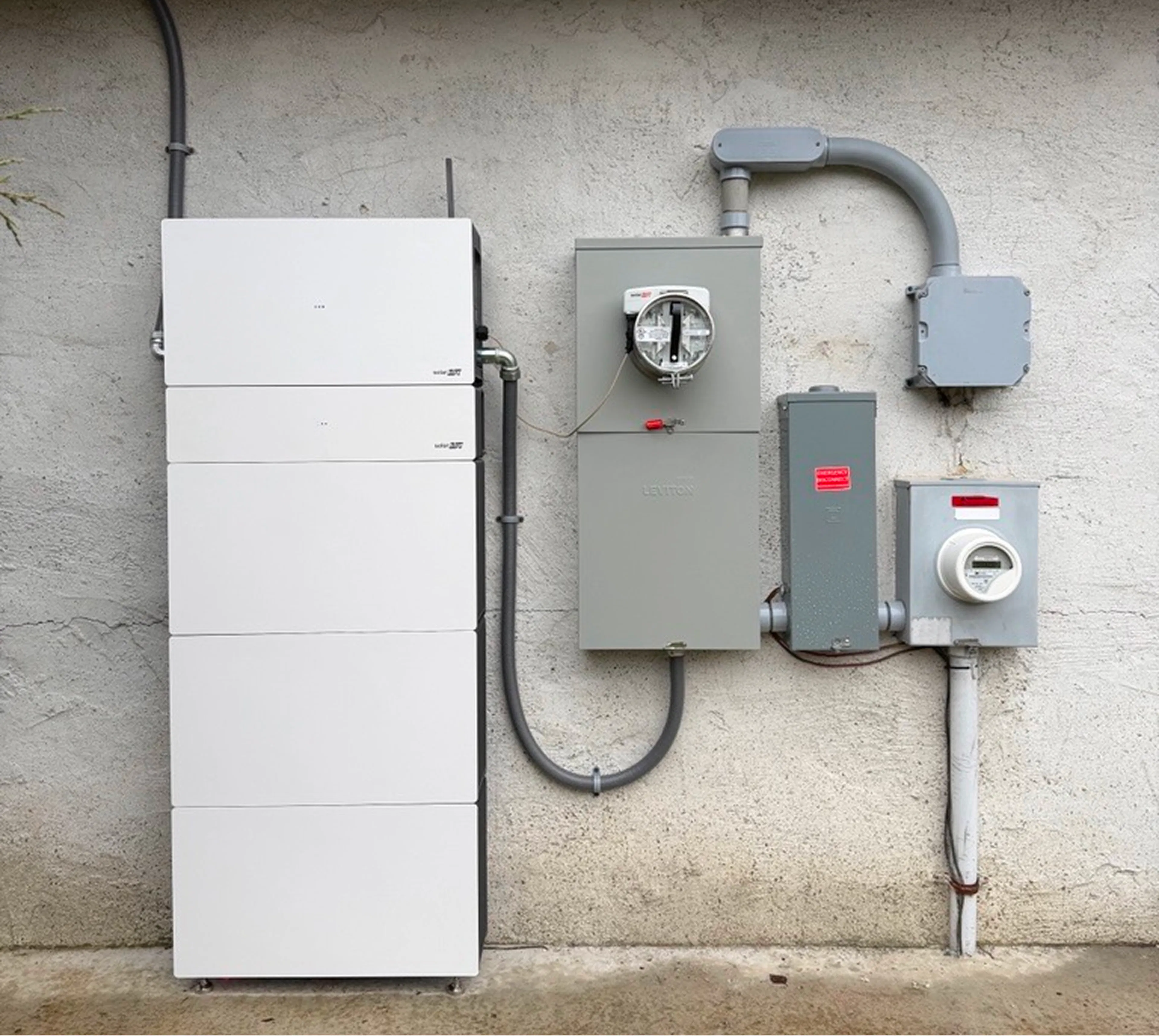 SolarEdge Nexis residential home-backup battery next to the ConnectDER IslandDER™ Meter Socket Adapter.