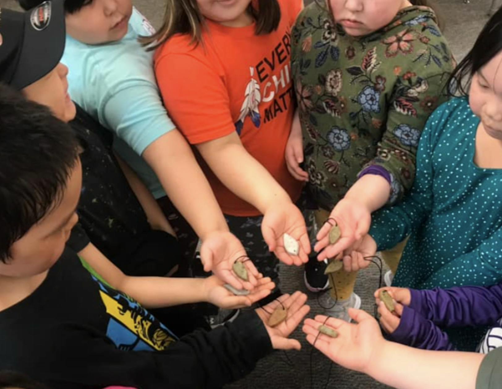 A group of students sharing their carvings
