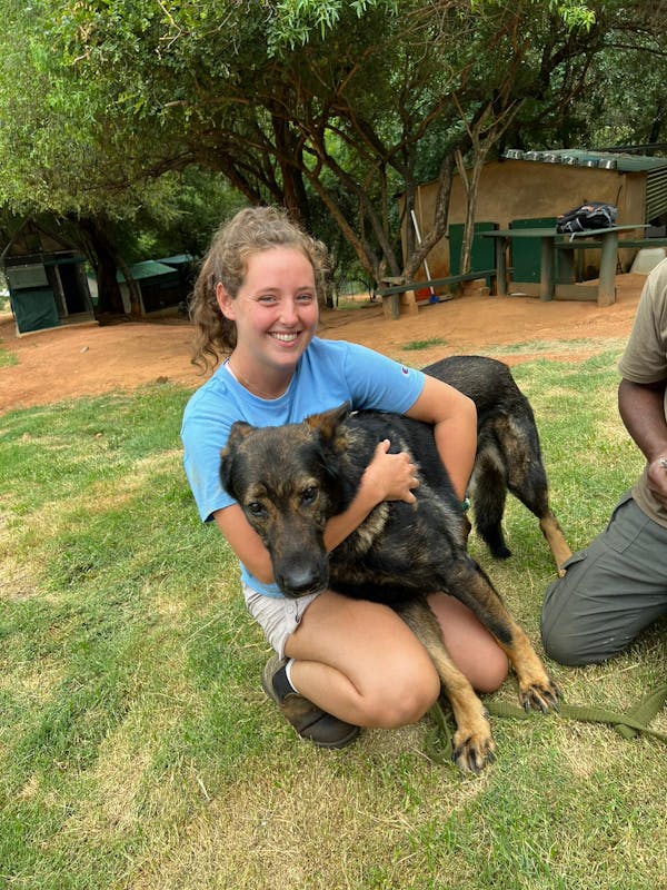 Katherine Prindle: cuddling an anti-poaching dog