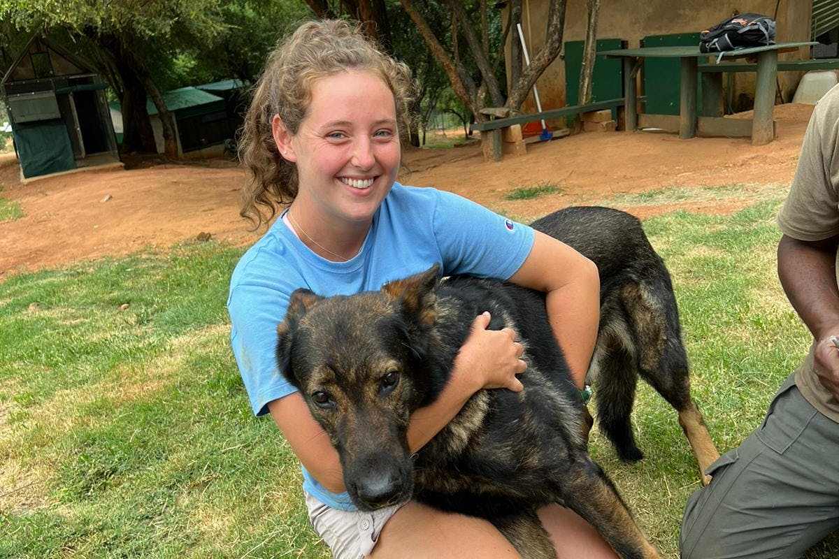 Katherine Prindle: cuddling an anti-poaching dog