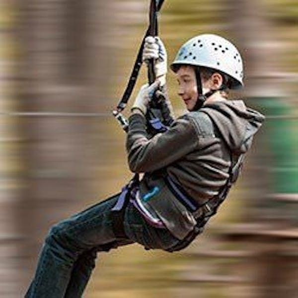 A child on a zip wire