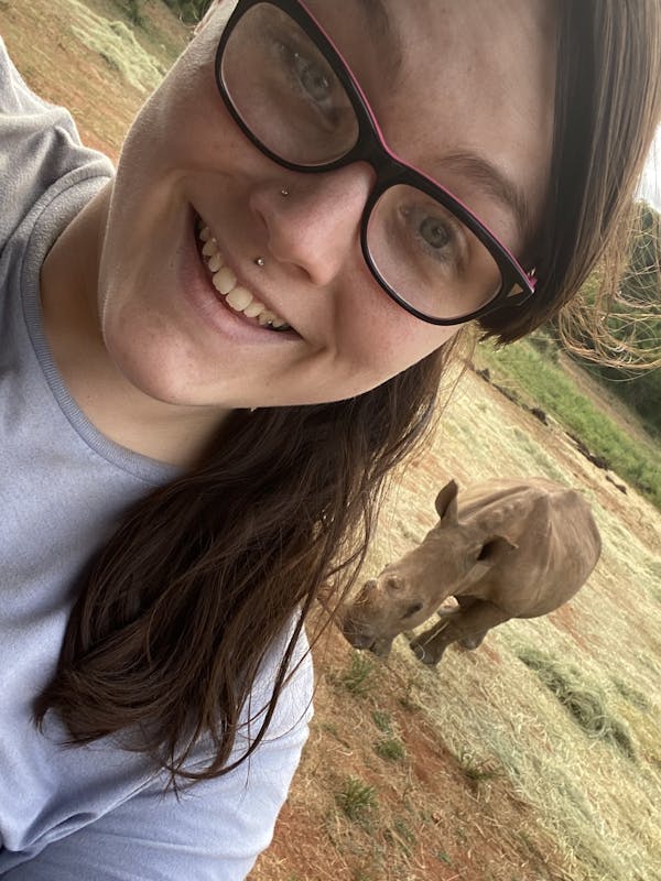 Chandra Kelton: baby rhino in the background