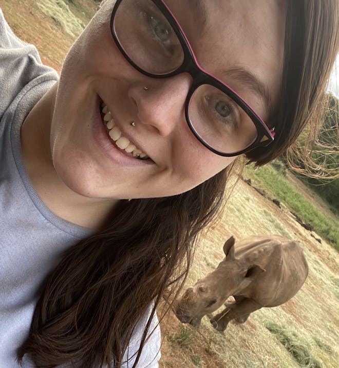 Chandra Kelton: baby rhino in the background