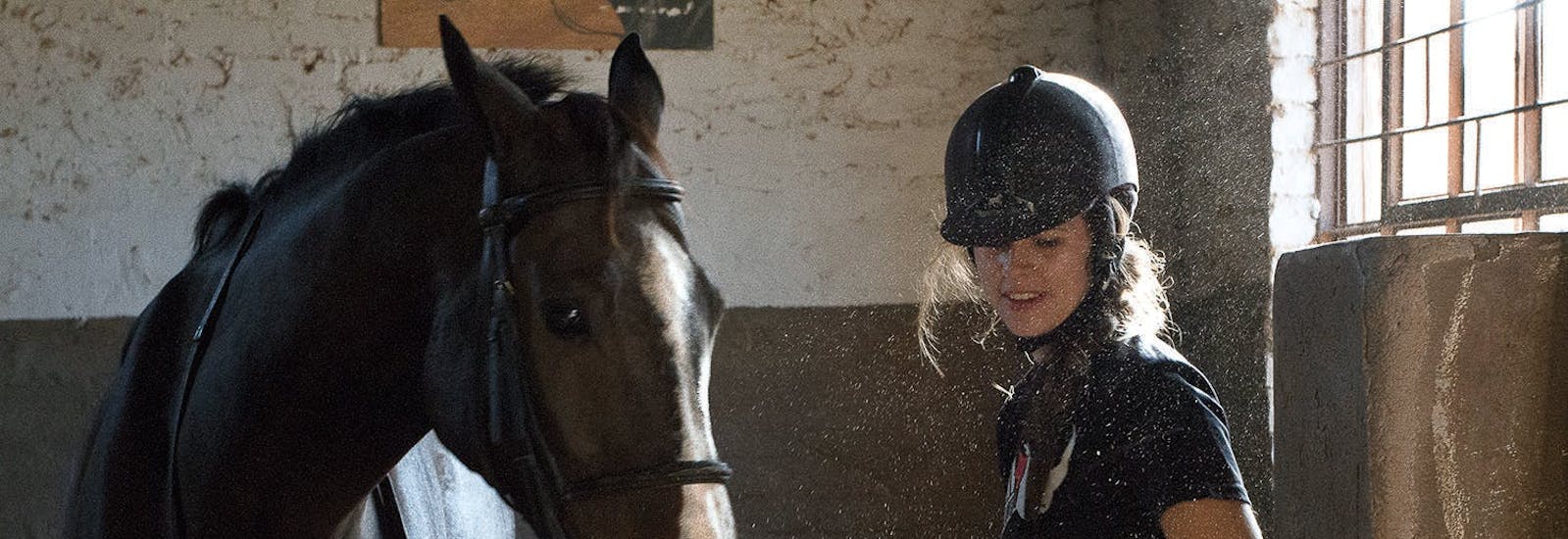 ACE volunteer looking after her horse as part of the Hanchi Horseback Safari experience