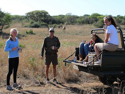 Victoria Neild: relaxing with other volunteers with the vehicle