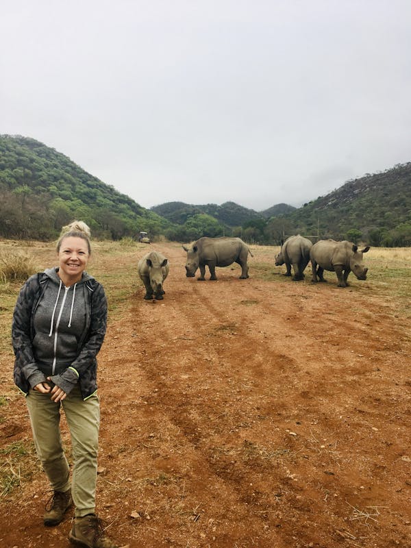 Maartje van Vlerken: posing with rhinos in the background