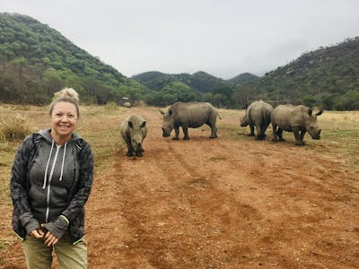 Maartje van Vlerken: posing with rhinos in the background