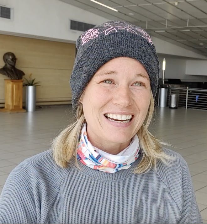 Rachel Binger: female volunteer standing in airport