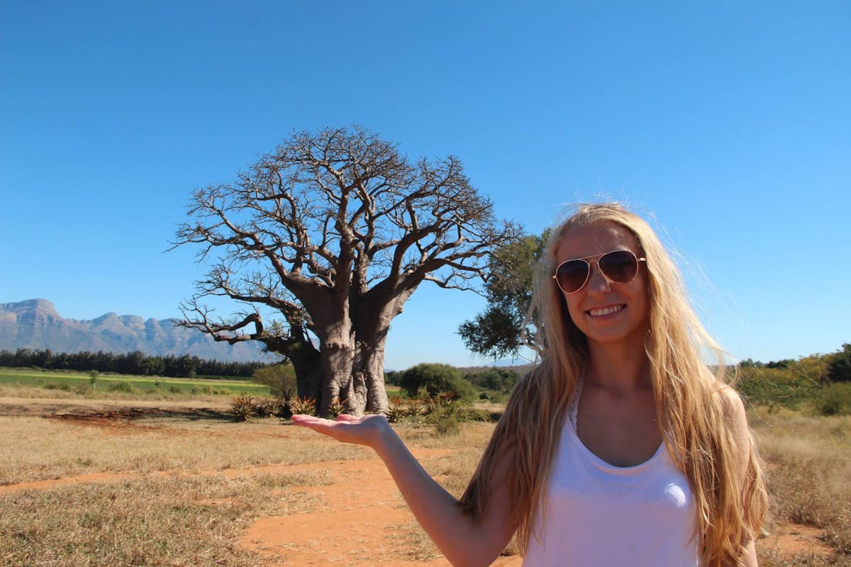 Kaitlyn Saul in front of a baobab tree