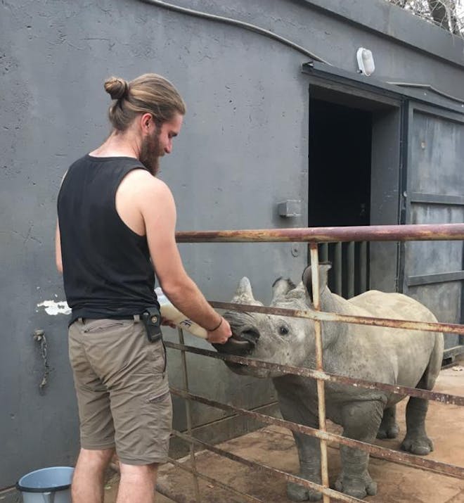Lucas Zermatten: feeding a baby rhino
