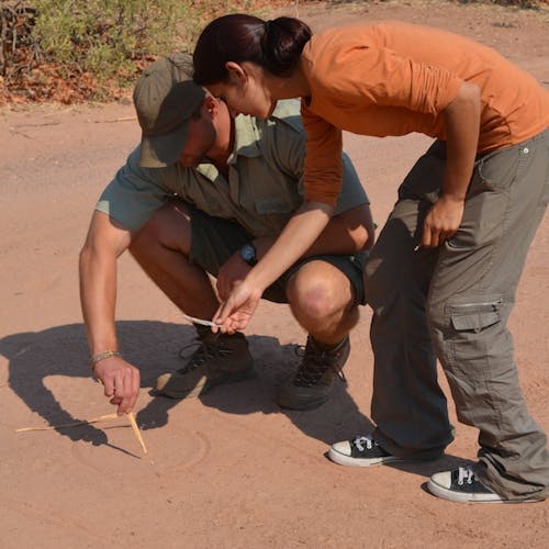 An ACE student learning to track on the Game Ranger Conservation Experience