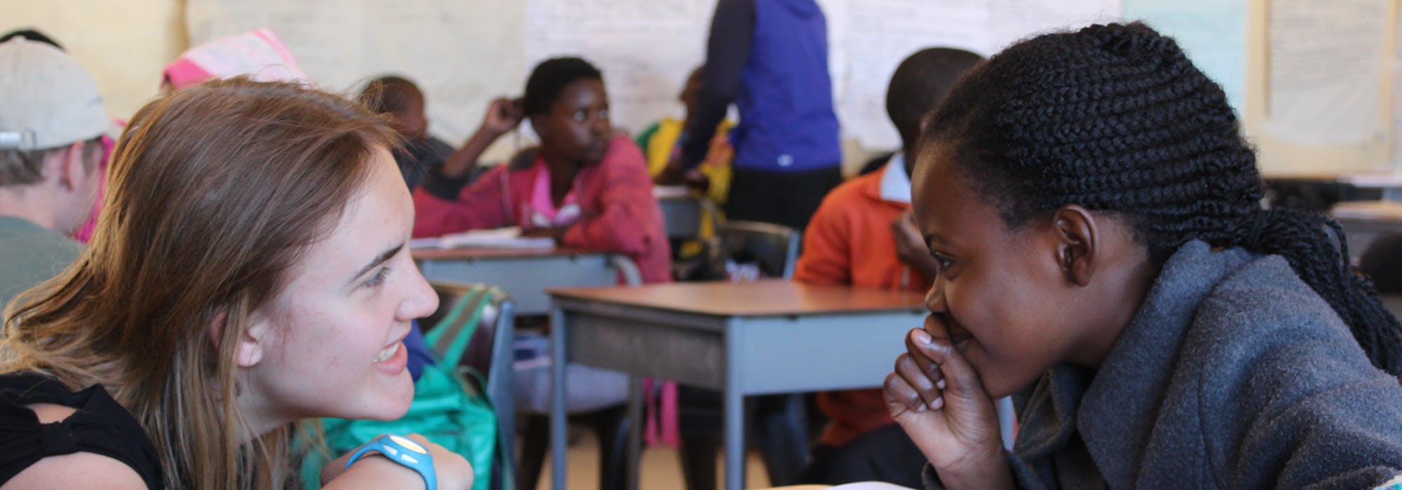 An ACE student in a classroom helping to teach children