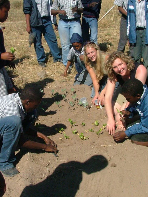 ACE students and teachers with the local community, learning about agriculture