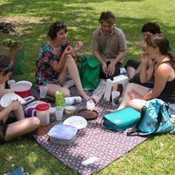 Friends having a picnic in a park
